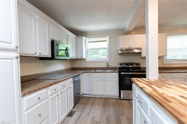 kitchen featuring stainless steel appliances, white cabinets, sink, light hardwood / wood-style floors, and ornamental molding