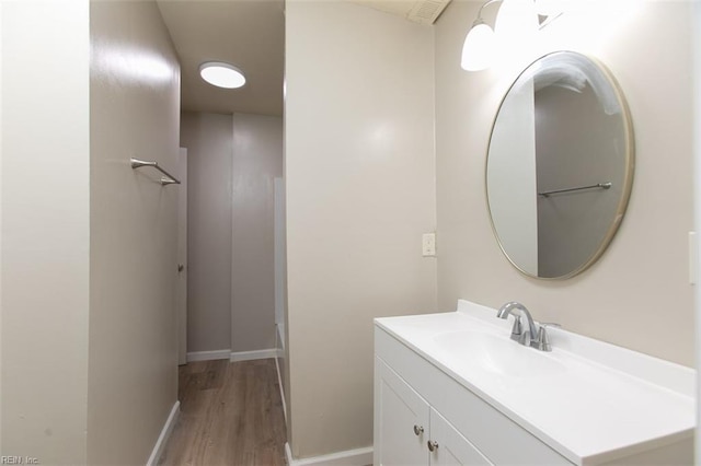 bathroom featuring hardwood / wood-style floors and vanity