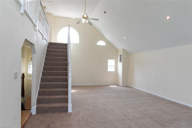 additional living space with carpet flooring, high vaulted ceiling, and ceiling fan