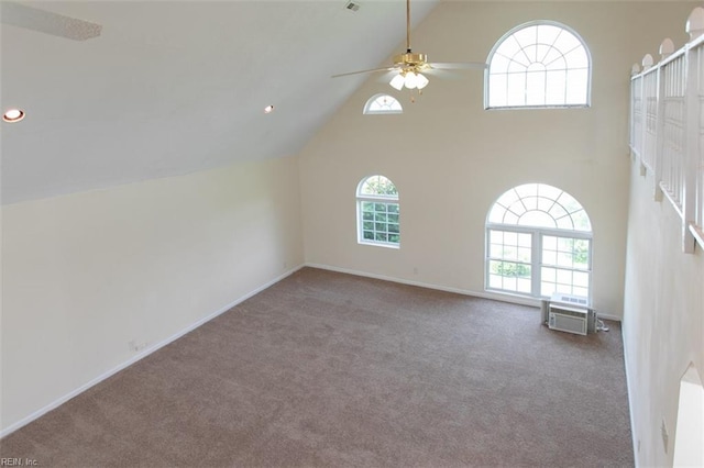 additional living space with carpet, ceiling fan, and high vaulted ceiling