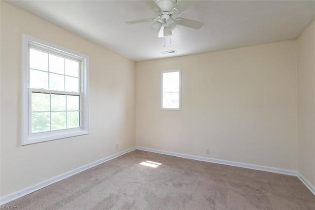 unfurnished room featuring carpet floors and ceiling fan