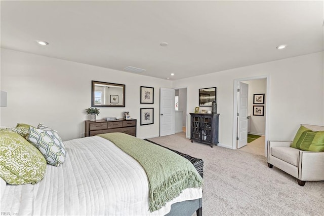 bedroom featuring light carpet