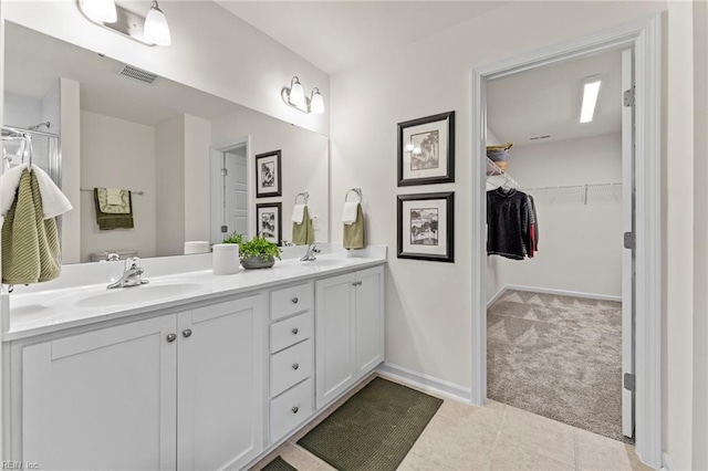 bathroom with vanity and tile patterned flooring