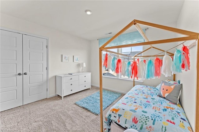 carpeted bedroom with a closet