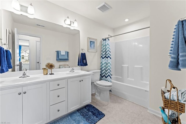 full bathroom featuring vanity, tile patterned flooring, toilet, and shower / bath combo with shower curtain