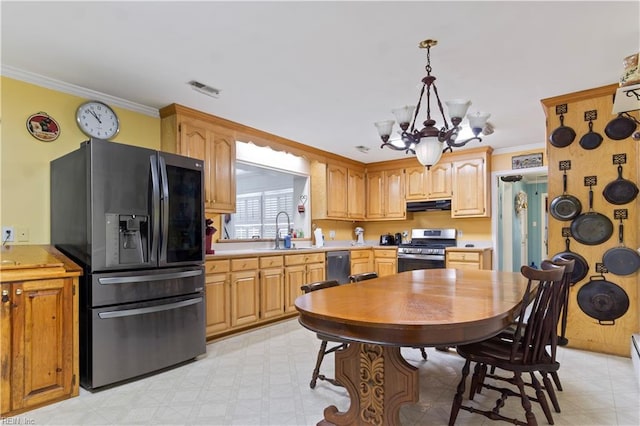 kitchen with decorative light fixtures, a chandelier, sink, appliances with stainless steel finishes, and light tile patterned floors