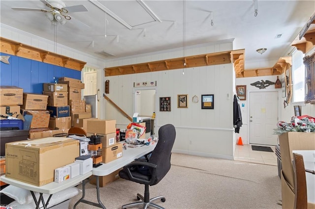 home office with attic access, a ceiling fan, carpet, and ornamental molding