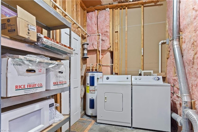 clothes washing area with electric water heater and independent washer and dryer