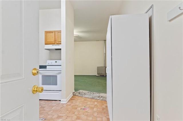 kitchen with stove and light tile patterned floors