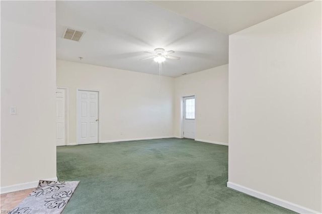 carpeted empty room featuring ceiling fan