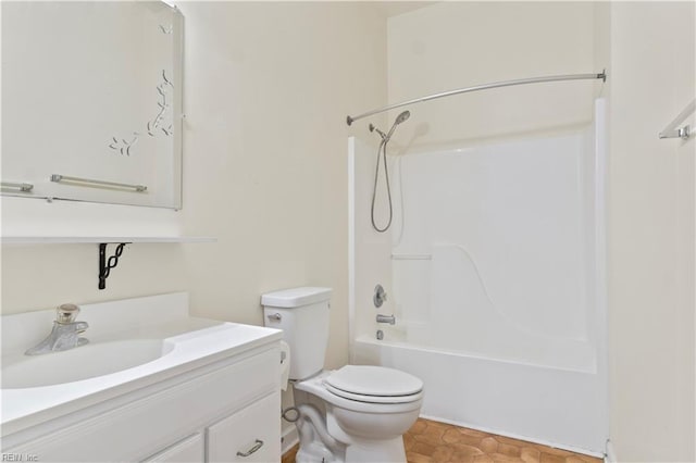 bathroom featuring toilet, vanity, and shower / tub combination