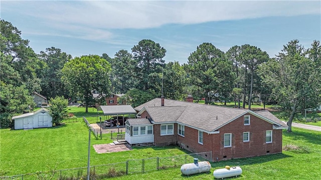 view of property exterior featuring a storage unit, crawl space, an outbuilding, and view of scattered trees
