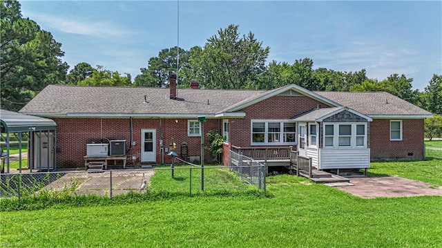 back of house with a yard