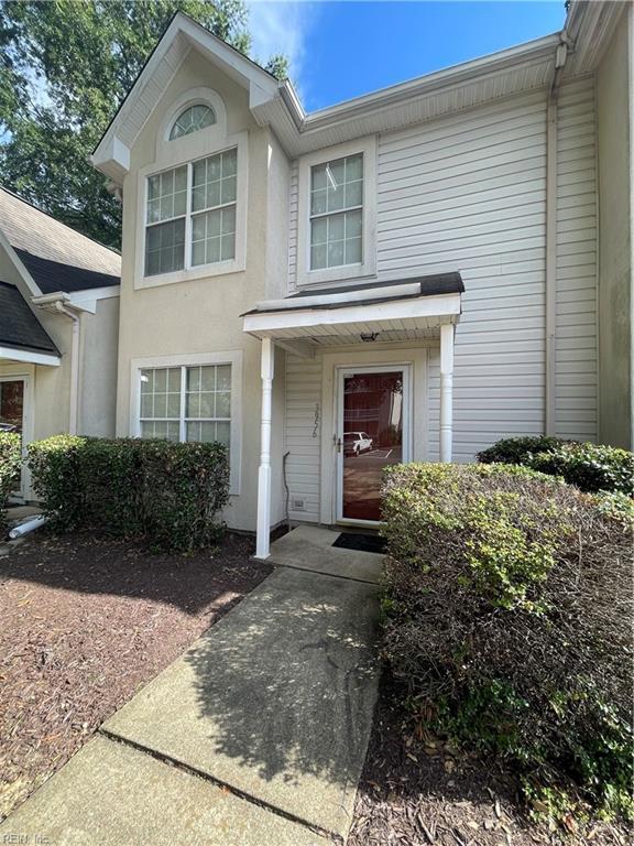 entrance to property featuring stucco siding