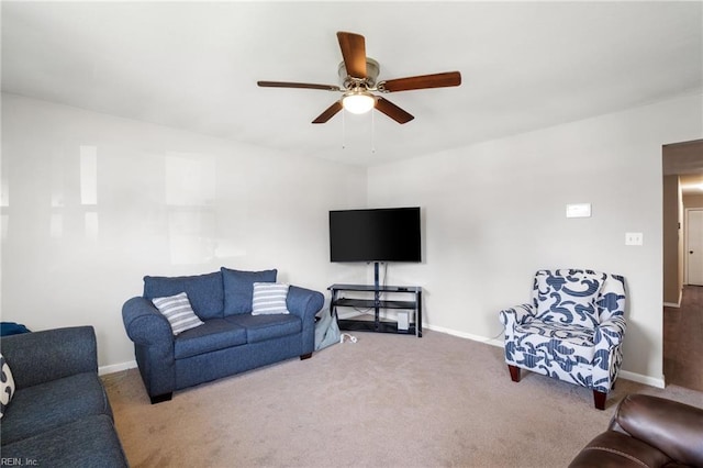 living room with ceiling fan and carpet