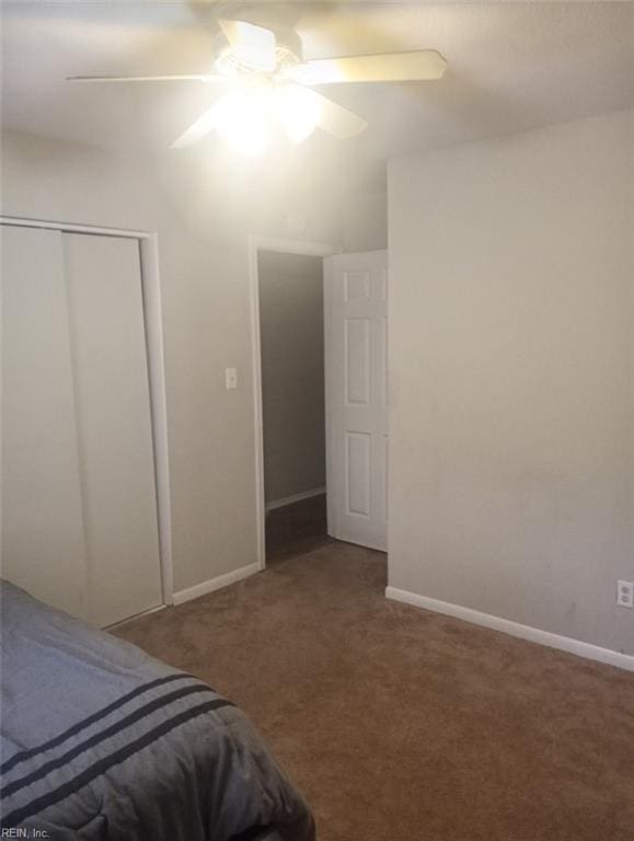 bedroom featuring ceiling fan, carpet flooring, and a closet