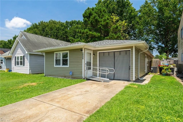 single story home featuring a garage and a front yard