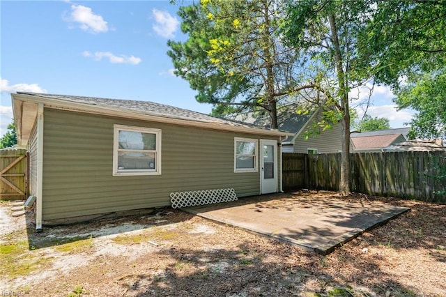 rear view of house with a patio