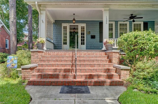 doorway to property with a porch and ceiling fan