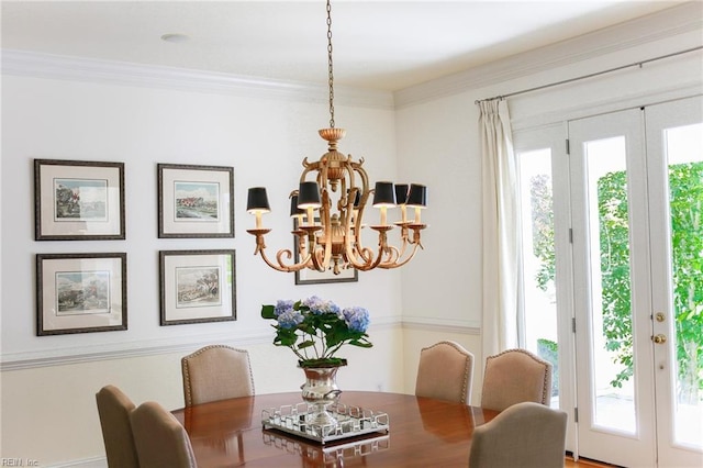 dining area with an inviting chandelier and crown molding