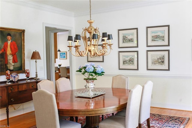 dining space featuring a notable chandelier, wood-type flooring, and ornamental molding