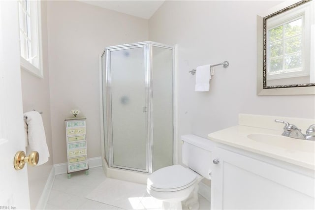 bathroom featuring tile patterned floors, toilet, an enclosed shower, and vanity