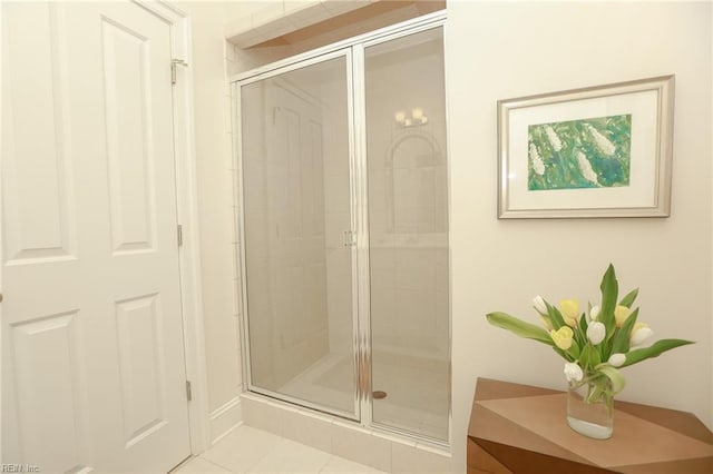 bathroom featuring tile patterned flooring and a shower with door