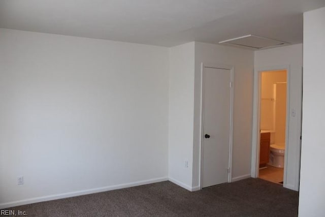 empty room with dark carpet