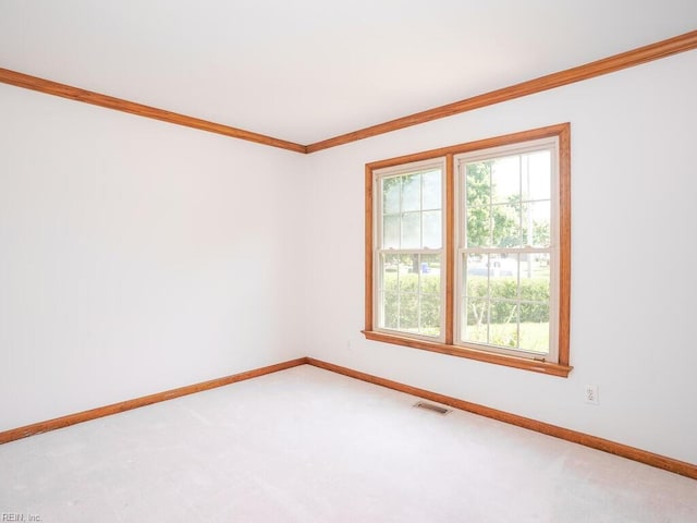 carpeted spare room with ornamental molding