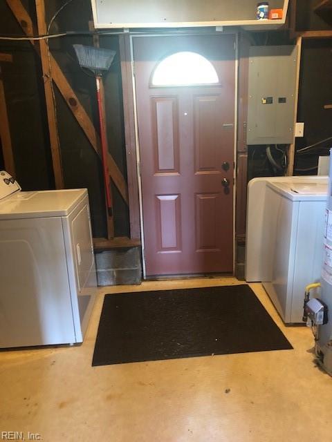 clothes washing area featuring washer and dryer and electric panel