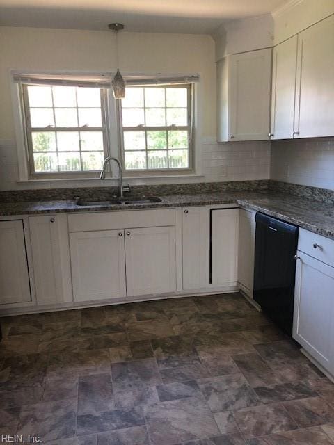 kitchen with white cabinetry, tasteful backsplash, sink, black dishwasher, and dark tile patterned flooring