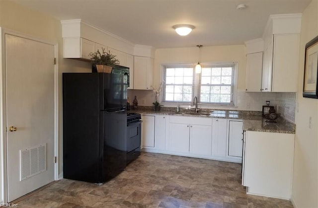 8530 Orcutt Ave, Hampton, VA 23605 - kitchen featuring black appliances, white cabinets, dark stone counters, stone finish floors, and decorative backsplash