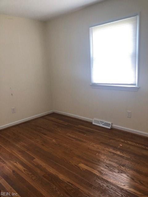 empty room featuring hardwood / wood-style flooring