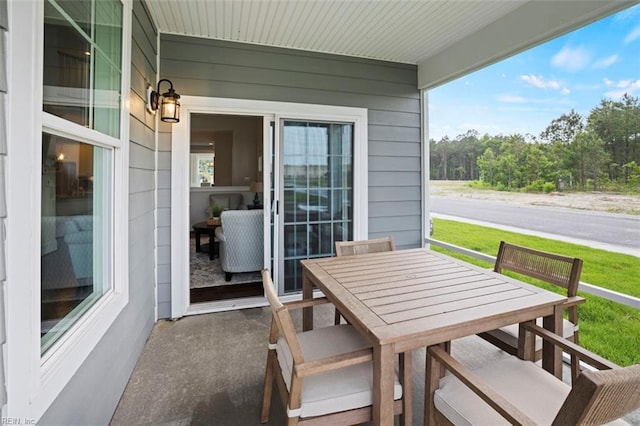 view of patio featuring outdoor dining area