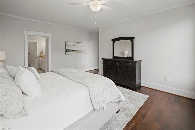 bedroom featuring ornamental molding, ensuite bath, ceiling fan, and dark wood-type flooring