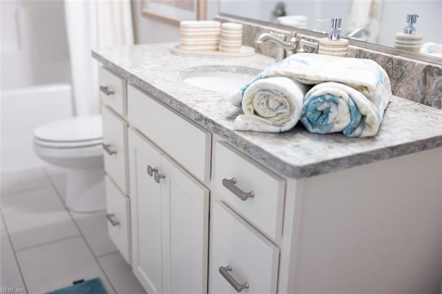 full bathroom with tile patterned flooring,  shower combination, toilet, and vanity