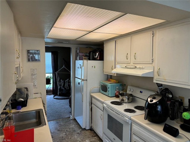 kitchen with sink, white appliances, and white cabinetry