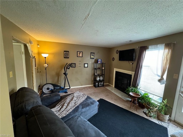 carpeted living room featuring a textured ceiling