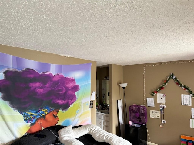 interior space with a textured ceiling