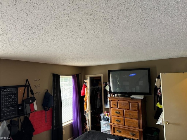 bedroom with a closet and a textured ceiling