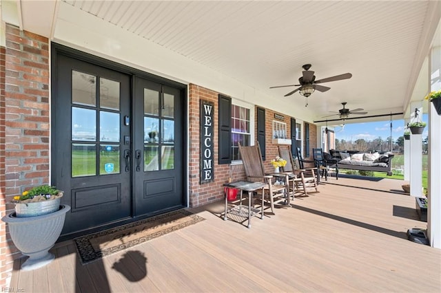 wooden terrace with french doors and ceiling fan