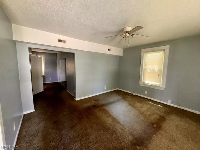 1030 37th St, Newport News, VA 23607 - empty room featuring visible vents, a ceiling fan, baseboards, and a textured ceiling