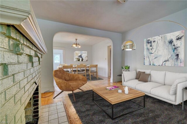 living room with hardwood / wood-style floors and a fireplace