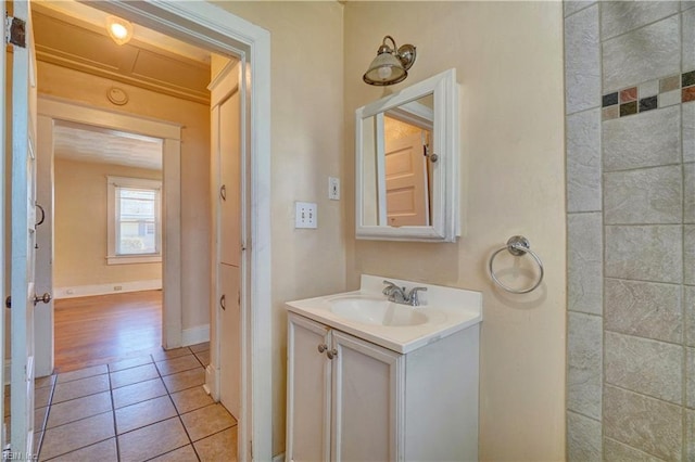 bathroom with tile patterned flooring and vanity