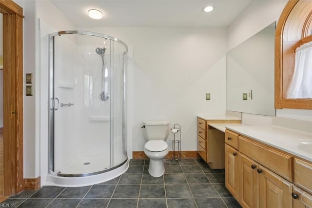 bathroom with walk in shower, tile patterned floors, toilet, and vanity