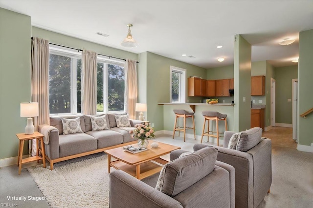 188 Tranquility Rd, Reedville, VA 22539 - living room featuring light colored carpet, baseboards, visible vents, and recessed lighting