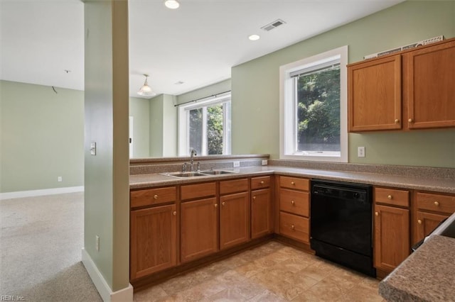 kitchen featuring light tile patterned floors, dishwasher, sink, and kitchen peninsula