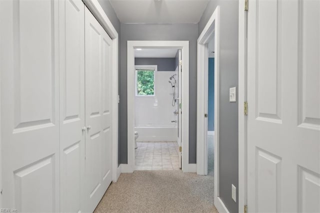 corridor with light colored carpet