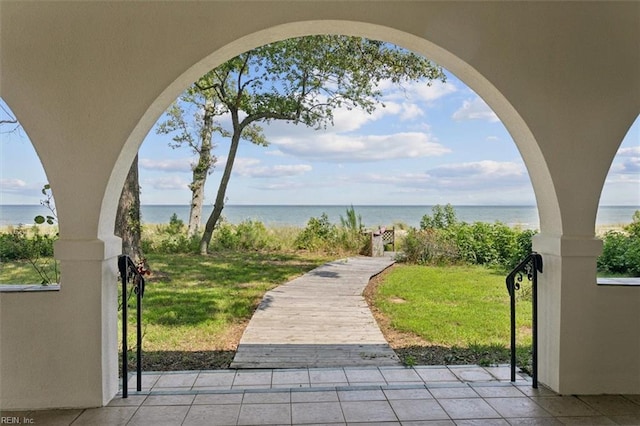 view of patio with a water view