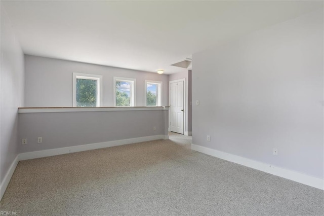 spare room with light carpet